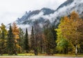Cloudy and foggy autumn alpine mountain scene. Austrian Lienzer Dolomiten Alps