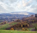 Cloudy and foggy autumn mountain countryside scene. Carpathians, Ukraine. Peaceful picturesque traveling, seasonal, nature and Royalty Free Stock Photo