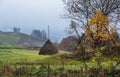 Cloudy and foggy autumn mountains scene. Peaceful picturesque traveling, seasonal, nature and countryside beauty concept scene. Royalty Free Stock Photo