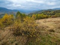 Cloudy and foggy day autumn mountains scene. Peaceful picturesque traveling, seasonal, nature and countryside beauty concept scene Royalty Free Stock Photo