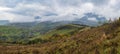 Cloudy and foggy day autumn mountains scene. Peaceful picturesque traveling, seasonal, nature and countryside beauty concept scene Royalty Free Stock Photo