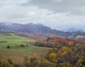 Cloudy and foggy day autumn mountains scene. Peaceful picturesque traveling, seasonal, nature and countryside beauty concept scene Royalty Free Stock Photo