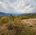 Cloudy and foggy day autumn mountains scene. Peaceful picturesque traveling, seasonal, nature and countryside beauty concept scene Royalty Free Stock Photo