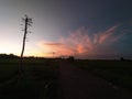 The cloudy landscape illuminated by the sun setting down