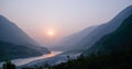 Cloudy landscape view of sunset over Indus river and layers of Karakoram mountain range, Pakistan Royalty Free Stock Photo