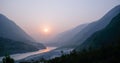 Cloudy landscape view of sunset over Indus river and layers of Karakoram mountain range, Pakistan