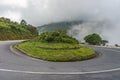 Cloudy and misty sky on horseshoe road curve on mountain Royalty Free Stock Photo
