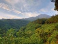 cloudy mount with sunrise beside