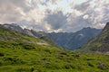 Cloudy mountain tops with glaciers in the French Alps