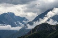 Cloudy mountains and planes passing by Royalty Free Stock Photo