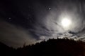 Cloudy night with stars and moon Royalty Free Stock Photo