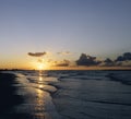 Cloudy orange sunset over sea water Royalty Free Stock Photo