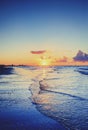 Cloudy orange sunset over sea water. Royalty Free Stock Photo