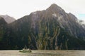 Boat cruising in Mildord sound, New Zealand Royalty Free Stock Photo