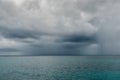 Cloudy rainy sky above great ocean