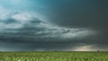 Cloudy Rainy Sky. Dramatic Sky With Dark Clouds In Rain Day. Storm And Clouds Above Summer Maize Corn Field. , , . 4K Royalty Free Stock Photo
