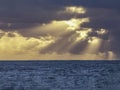 Cloudy seascape with sunbeams at sunseat Royalty Free Stock Photo