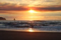 Cloudy skies and sunset over Oregon Coast Pacific ocean rocky outcrops