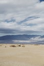 Cloudy sky above mountains and desert landscape Royalty Free Stock Photo