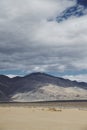 Cloudy sky above mountains and desert landscape Royalty Free Stock Photo