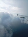 Cloudy, sky blue, airplane, flying high, airplane wings Royalty Free Stock Photo