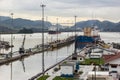 Cloudy sky and boat at Panama Canal locks Royalty Free Stock Photo