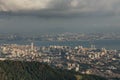 Cloudy sky, cityscape and mountain with green that viewed from Penang HIll at George Town. Penang, Malaysia