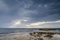 Cloudy sky with coast, Is Aruttas, Sardinia Royalty Free Stock Photo