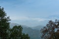 Cloudy sky and distant mountains of Himalayas, monsoon landscape of Garhwal, Uttarakhand, India. Climate change effect on Himalays