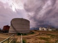 The cloudy sky and industrial storagetank.