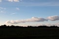 A cloudy sky over a cultivated land and trees in geeste emsland germany Royalty Free Stock Photo