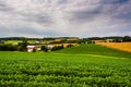 Cloudy sky over farm fields and rolling hills in rural York County, Pennsylvania. Royalty Free Stock Photo