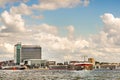 Cloudy sky over high rise buildings near Muziekgebouw aan `t IJ concert hall, Amsterdam Royalty Free Stock Photo