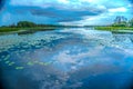 Cloudy sky over the lake. Rainy summer day.