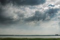 Cloudy sky over the river Thames, Grays, Essex