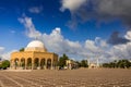 Cloudy sky over square in oriental city