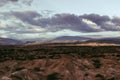 Cloudy sky over the valley with wild plants at the Tatacoa Desert, Colombia at sunset