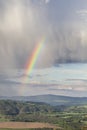 Cloudy sky with a rainbow in bright colors Royalty Free Stock Photo