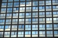 Cloudy sky reflection on glass surface of modern building Royalty Free Stock Photo