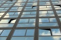 Cloudy sky reflection on glass surface of modern building Royalty Free Stock Photo