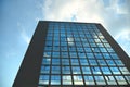 Cloudy sky reflection on glass surface of modern building Royalty Free Stock Photo