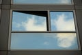 Cloudy sky reflection on glass surface of modern building Royalty Free Stock Photo