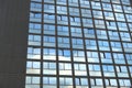 Cloudy sky reflection on glass surface of modern building Royalty Free Stock Photo