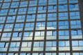 Cloudy sky reflection on glass surface of modern building Royalty Free Stock Photo