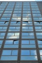 Cloudy sky reflection on glass surface of modern building Royalty Free Stock Photo