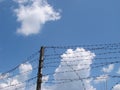 Cloudy sky with rugged wire fence 1 Royalty Free Stock Photo