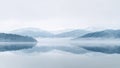A cloudy sky and snow-covered mountains surround a lake in the foreground, with a few clouds in the foreground, in the Royalty Free Stock Photo