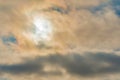 Cloudy sky, sun behind clouds. Strange view of a cloudy sky with the sun`s rays seen from behind the clouds. Cloudy sky with Royalty Free Stock Photo