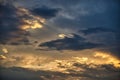 Cloudy sky with sun shining through clouds Royalty Free Stock Photo