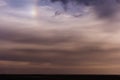 Cloudy sky with sundog Royalty Free Stock Photo